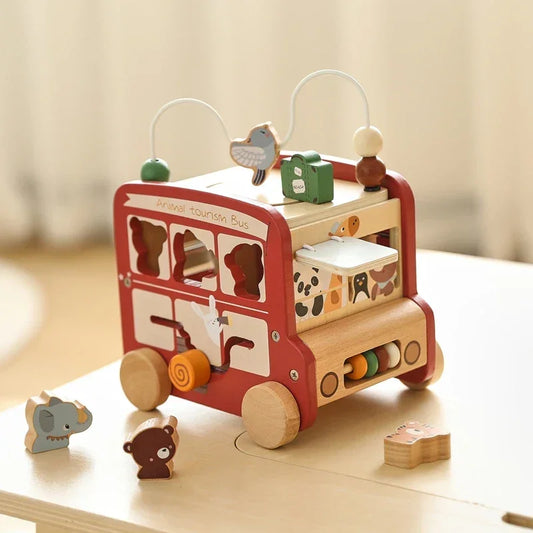 Wooden activity bus showing multiple interactive elements and features