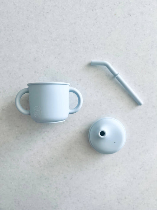 A close-up showing the soft textures and quality craftsmanship of the Mini & Me Transitional Straw Sippy Cup Ice Blue.