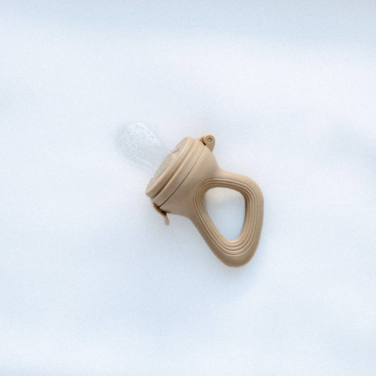 A close-up showing the soft textures and quality craftsmanship of the Baby Feeder Terracotta.