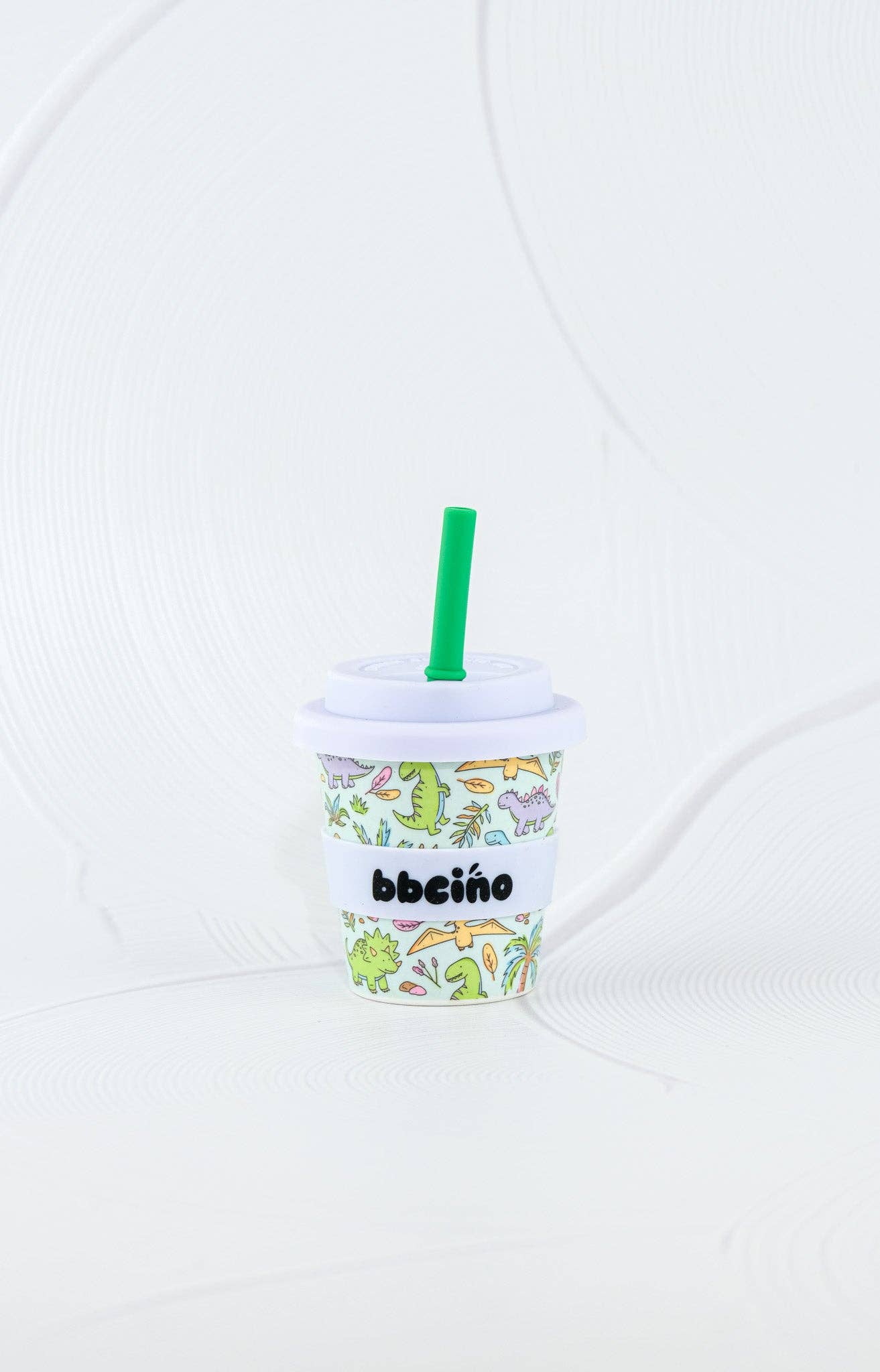 A close-up showing the soft textures and quality craftsmanship of the Sip-a-saurus Babycino Cup - 120ml (STRAW INCLUDED).