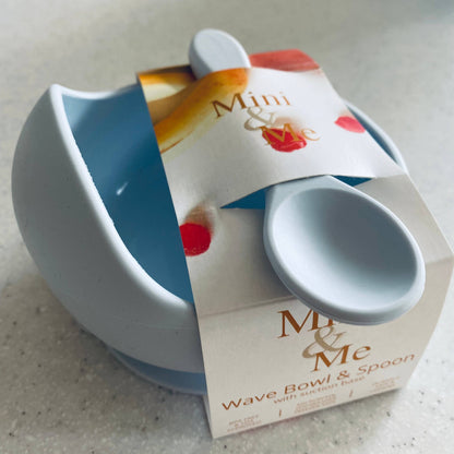 A beautiful lifestyle shot of Mini & Me Wave Bowl & Spoon Ice Blue in almond, ice-blue and kale-green by Cuddle Bug & Co i...