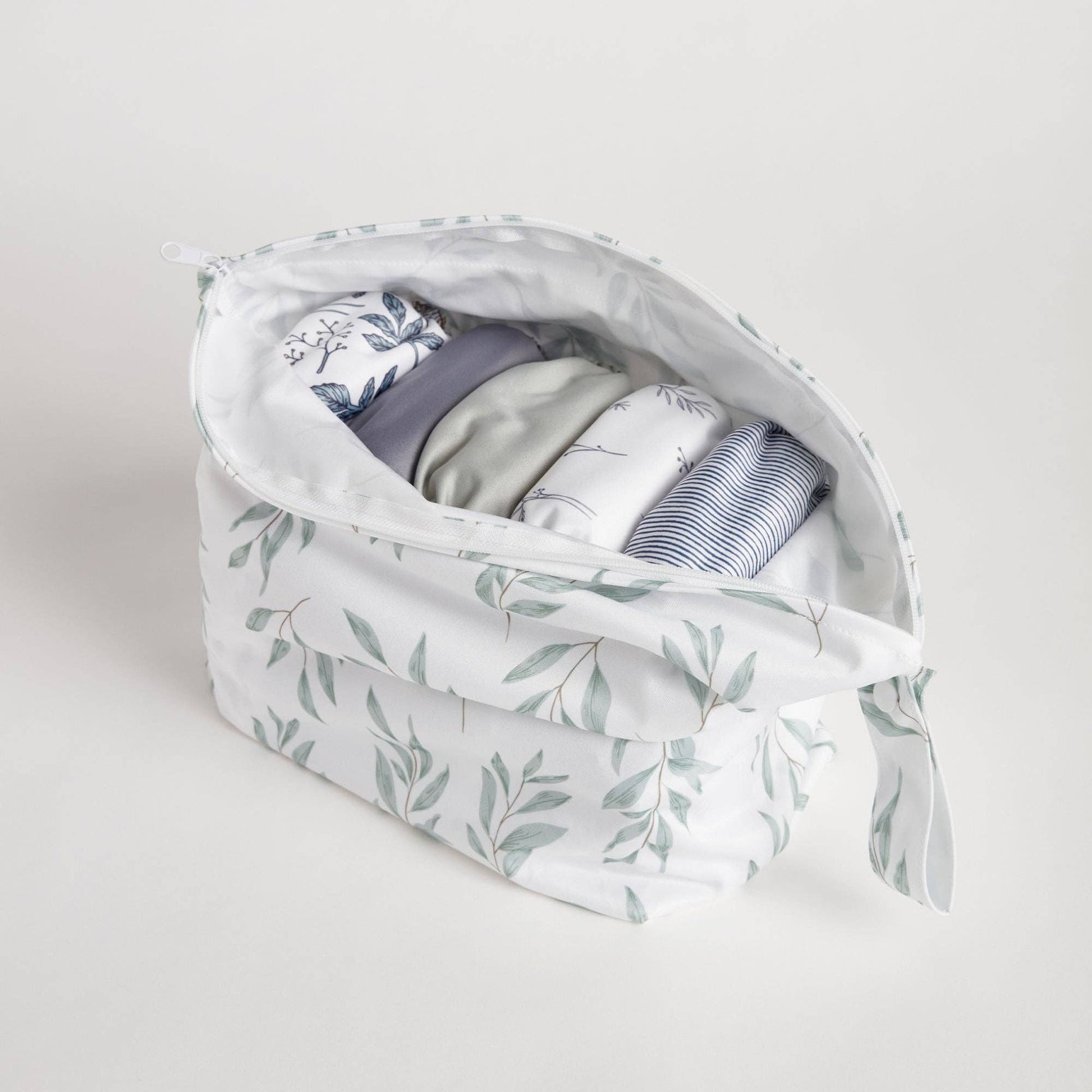 The Desert Moon Big Wet Bag in beige, animal and brown styled beautifully on a shelf in a child's bedroom.