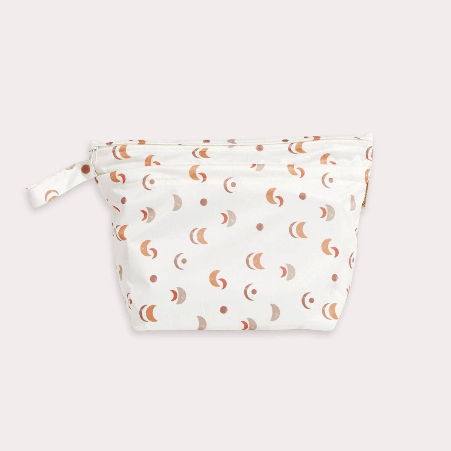 A beautiful lifestyle shot of Desert Moon Big Wet Bag in beige, animal and brown by EcoNaps in a home setting.
