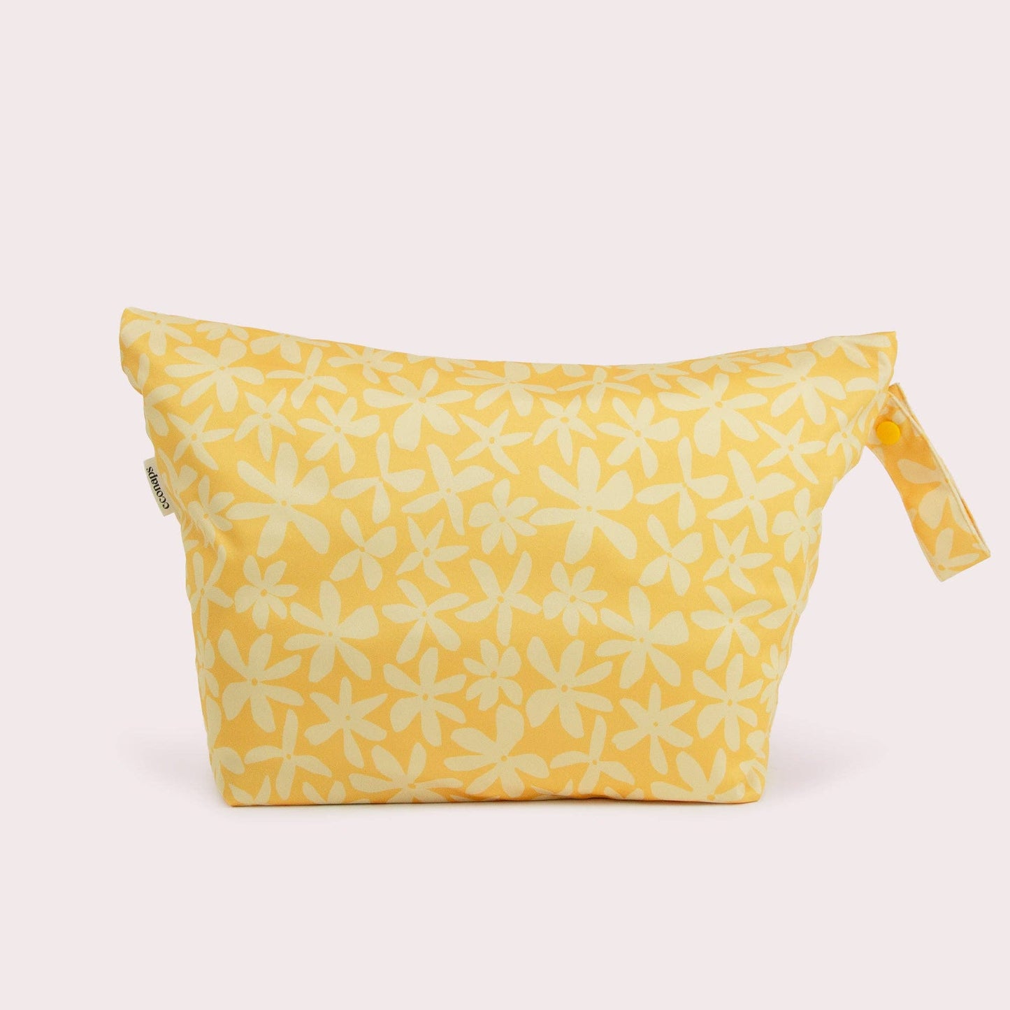The Daisy Big Wet Bag in beige, animal and brown styled beautifully on a shelf in a child's bedroom.