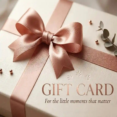Gift card with a pink ribbon and decorative elements on a light background