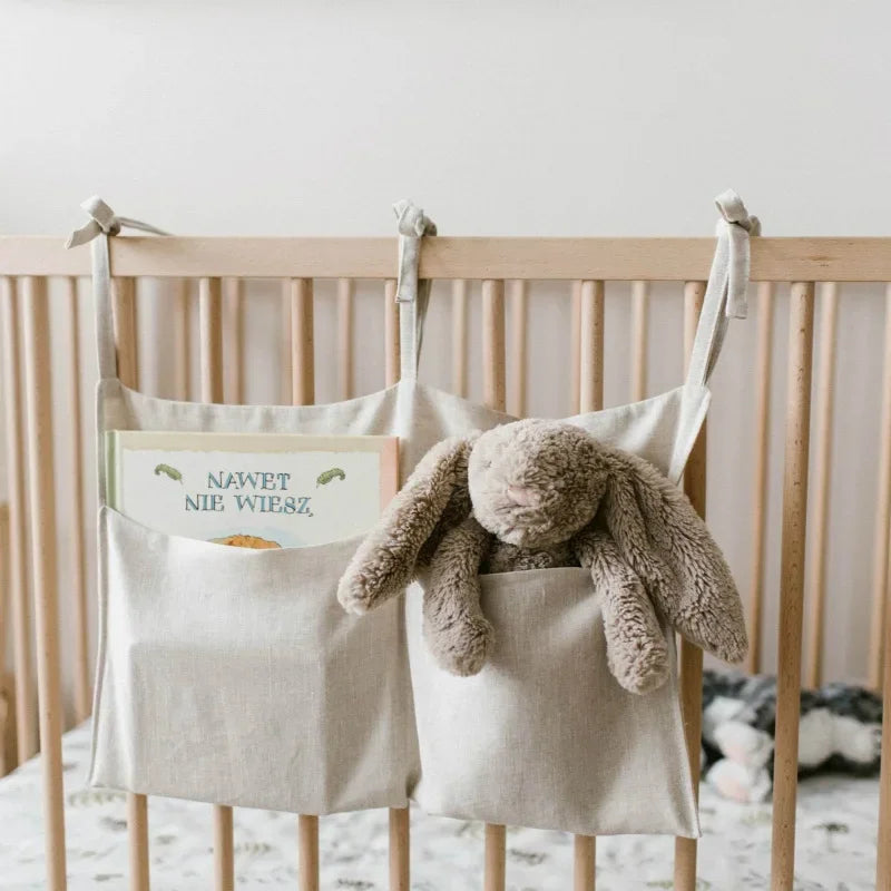 Crib caddy with adjustable straps - keeps nappies and essentials within reach