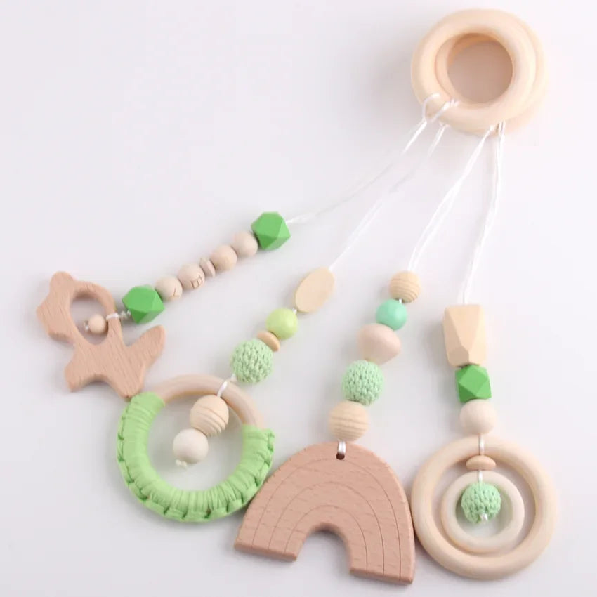 4-piece wooden toy set for baby gym, pram and activity arch