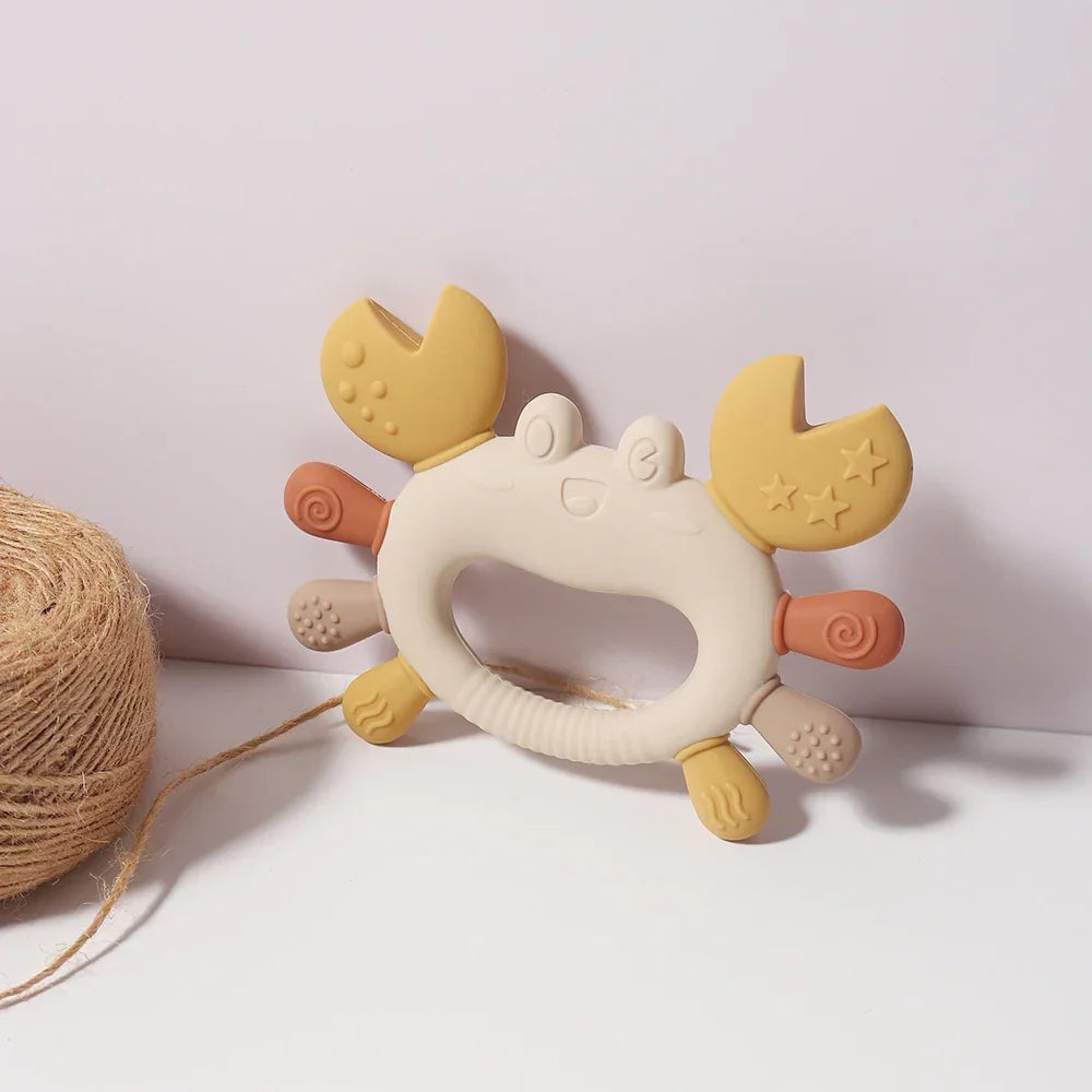 Crab teether size comparison showing easy-grip design for babies