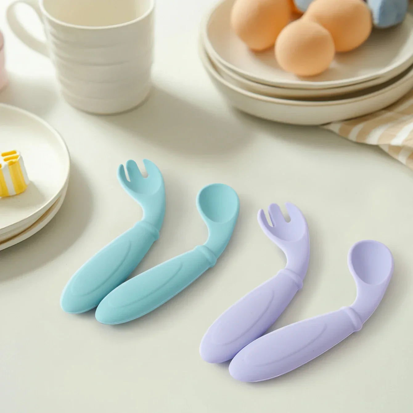 Silicone utensils showing shallow spoon bowl for little mouths