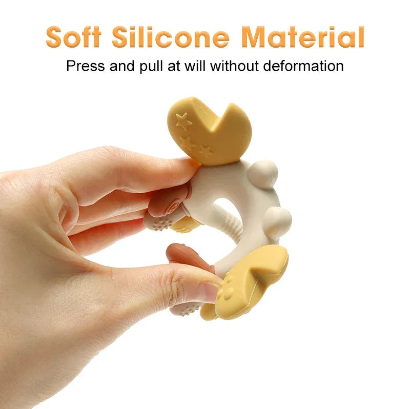 Orange crab teether demonstrating flexible silicone material