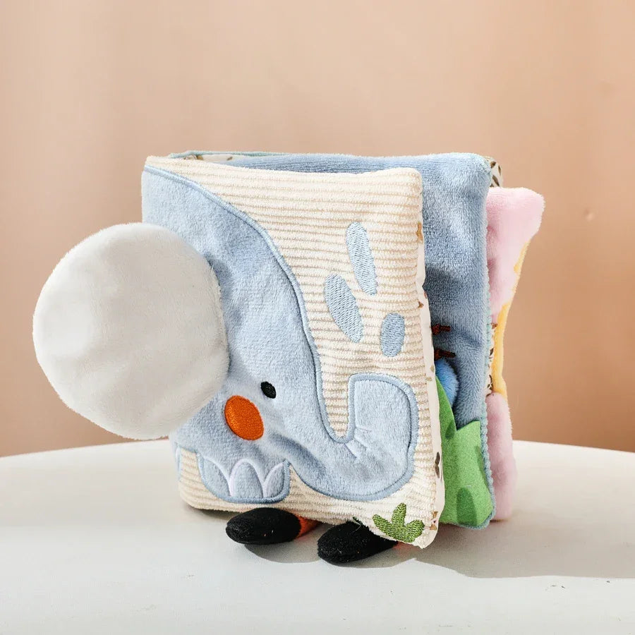 Baby cloth book showing crinkly textures and colorful animal illustrations