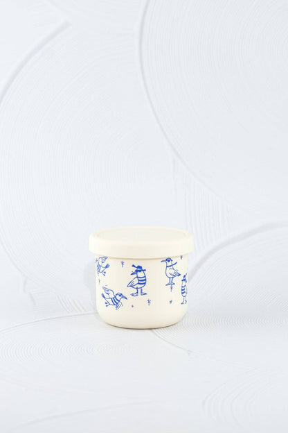 The Chippie Crew Silicone SNACK POT  styled beautifully on a shelf in a child's bedroom.