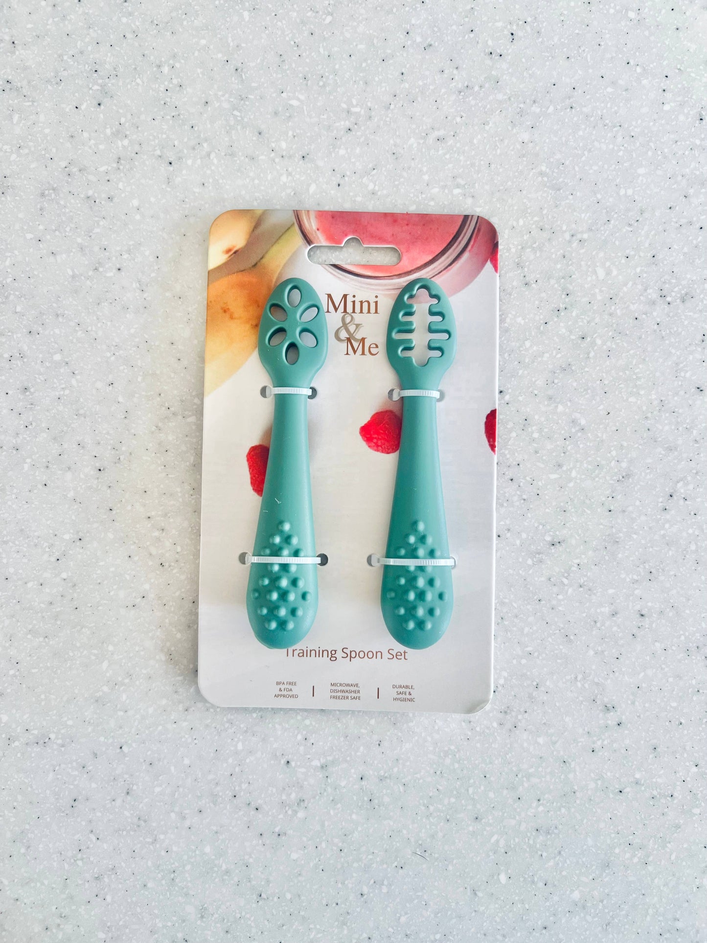 A close-up showing the soft textures and quality craftsmanship of the Mini & Me Training Spoon Set Kale.