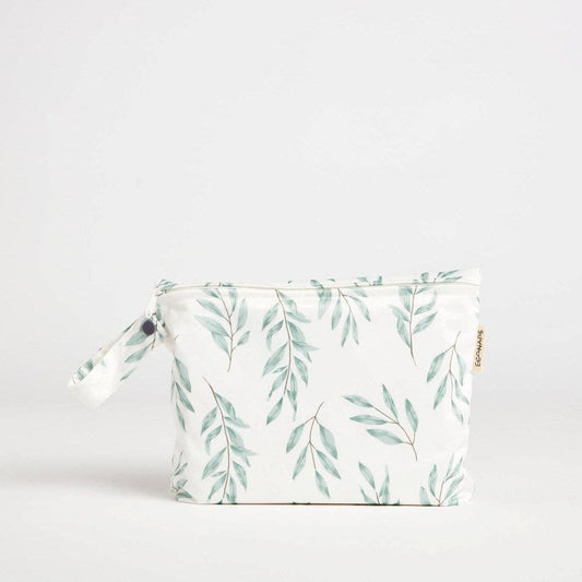 A beautiful lifestyle shot of Olive Leaf Mid Wet Bag: Olive Leaf in beige, animal and brown by EcoNaps in a home setting.